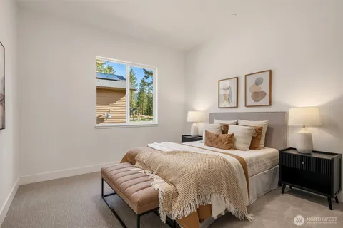 a bedroom with a bed and a couch