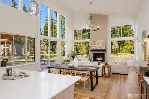 a room with fireplace furniture and a large window