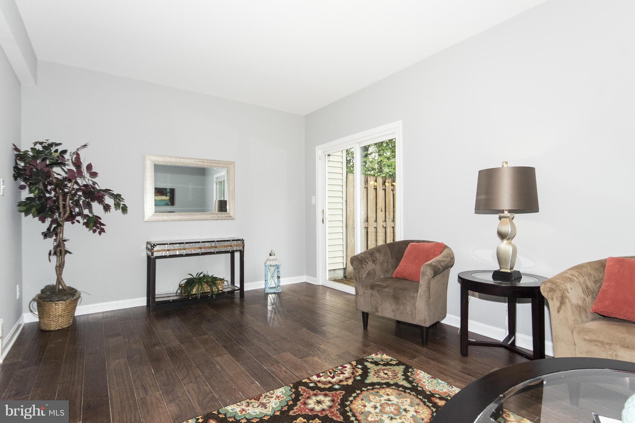 47 Robin Ridge Court Baltimore, MD 21234 - Photo 13 of 30 a living room with furniture and a fireplace
