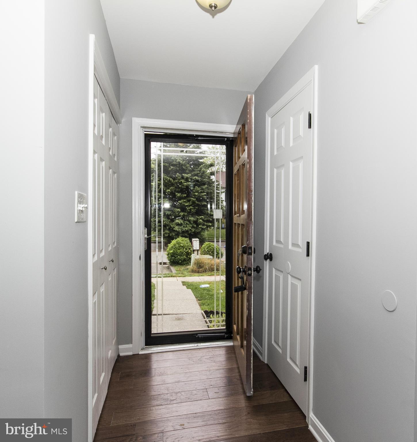 47 Robin Ridge Court Baltimore, MD 21234 - Photo 3 of 30 a view of a hallway with wooden floor and windows