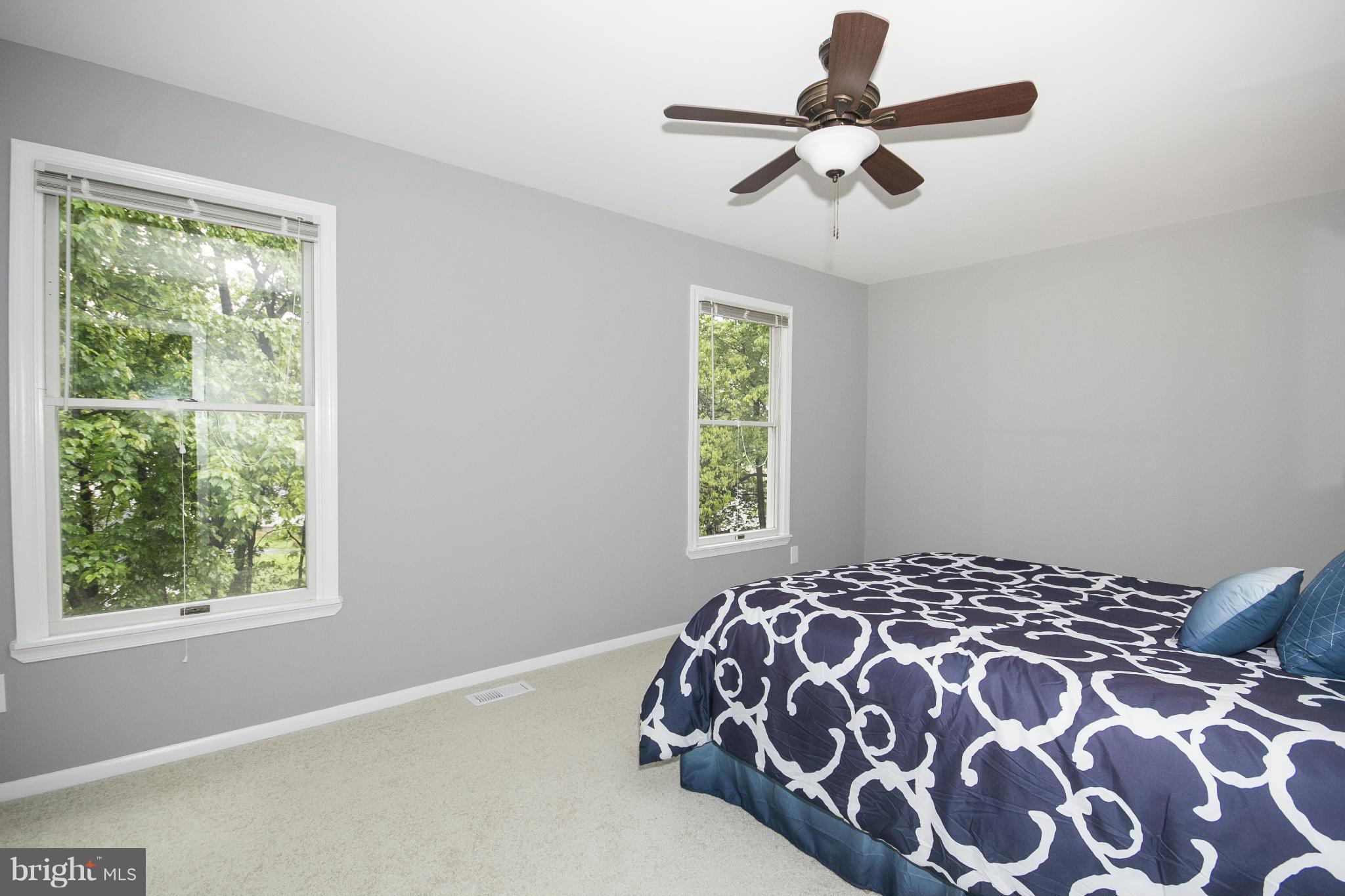 47 Robin Ridge Court Baltimore, MD 21234 - Photo 22 of 30 a bedroom with a bed and a window