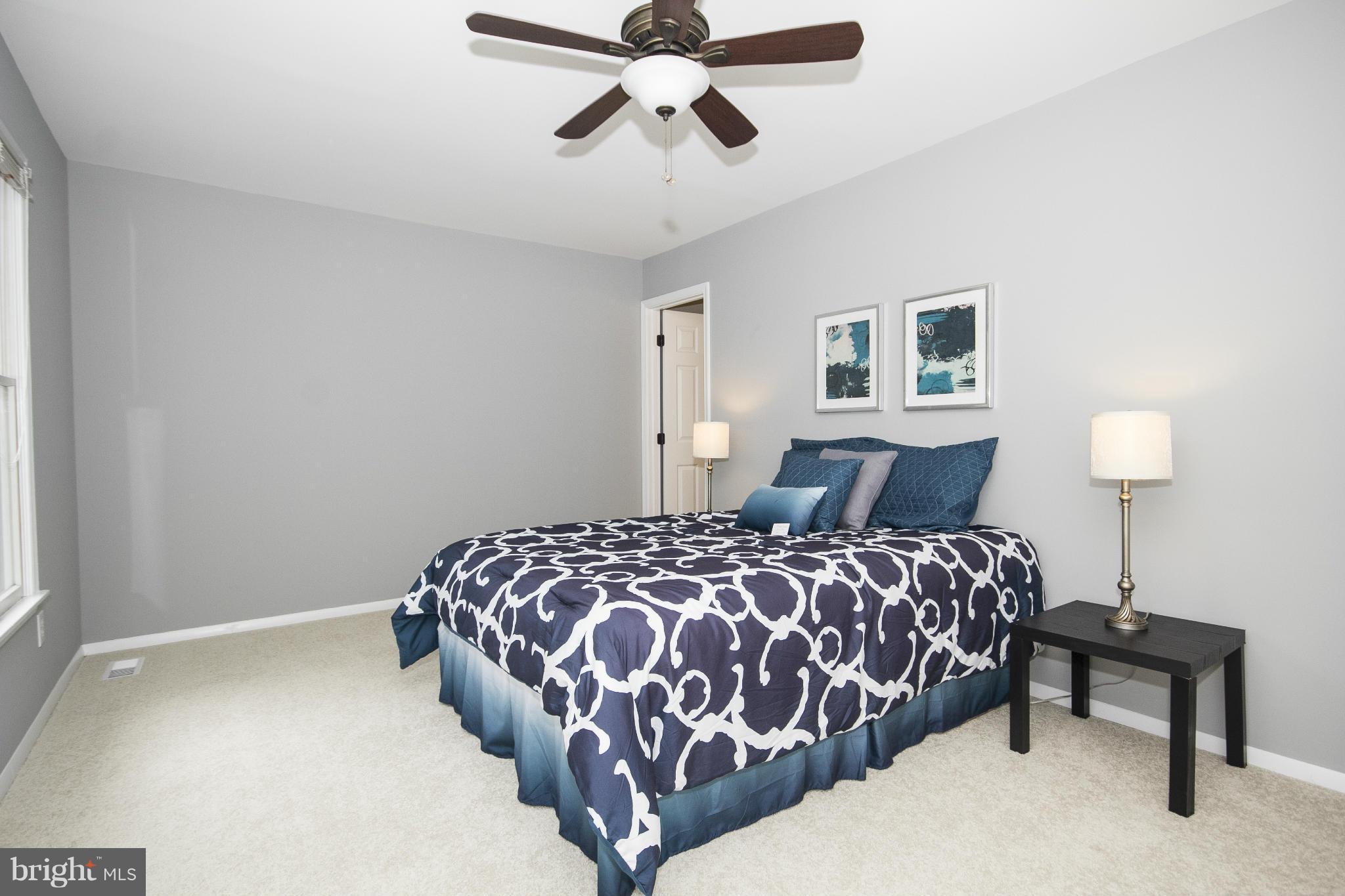 47 Robin Ridge Court Baltimore, MD 21234 - Photo 23 of 30 a bedroom with a bed and window