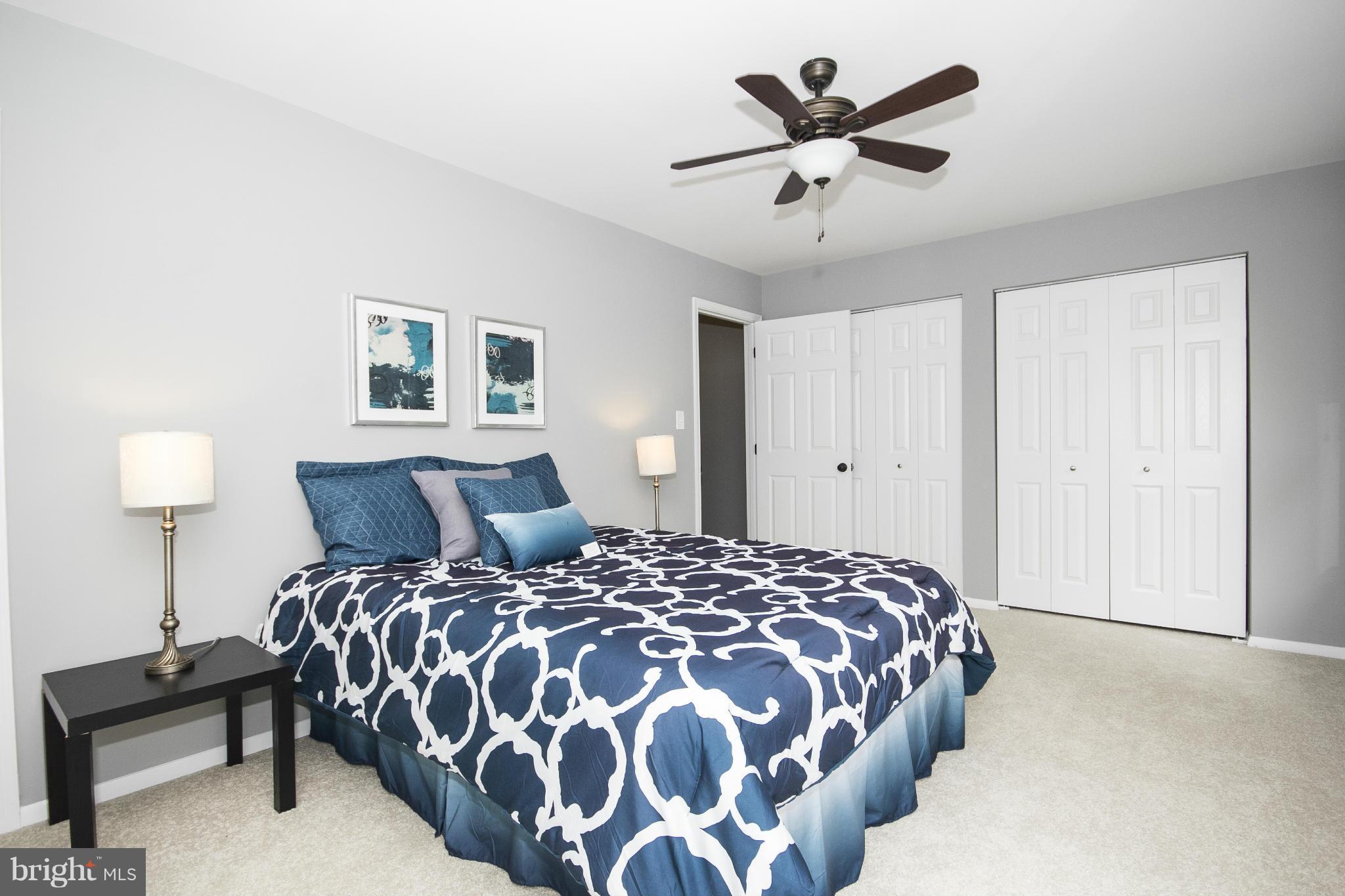 47 Robin Ridge Court Baltimore, MD 21234 - Photo 24 of 30 a bedroom with bed and a chandelier