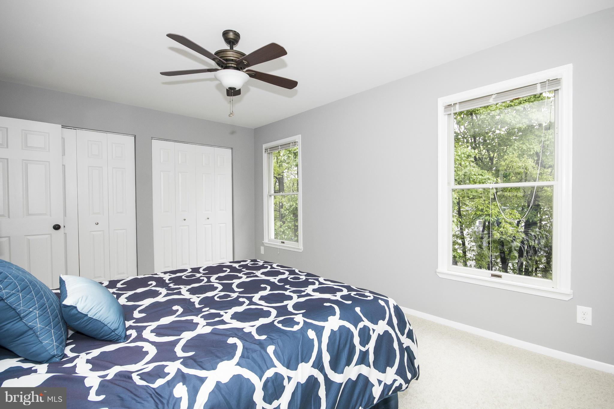 47 Robin Ridge Court Baltimore, MD 21234 - Photo 25 of 30 a bedroom with a large bed and a window