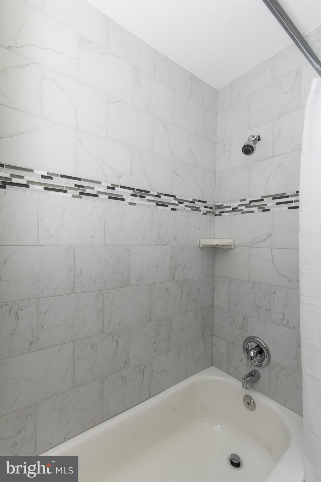 47 Robin Ridge Court Baltimore, MD 21234 - Photo 30 of 30 a bathroom with a bathtub and a shower