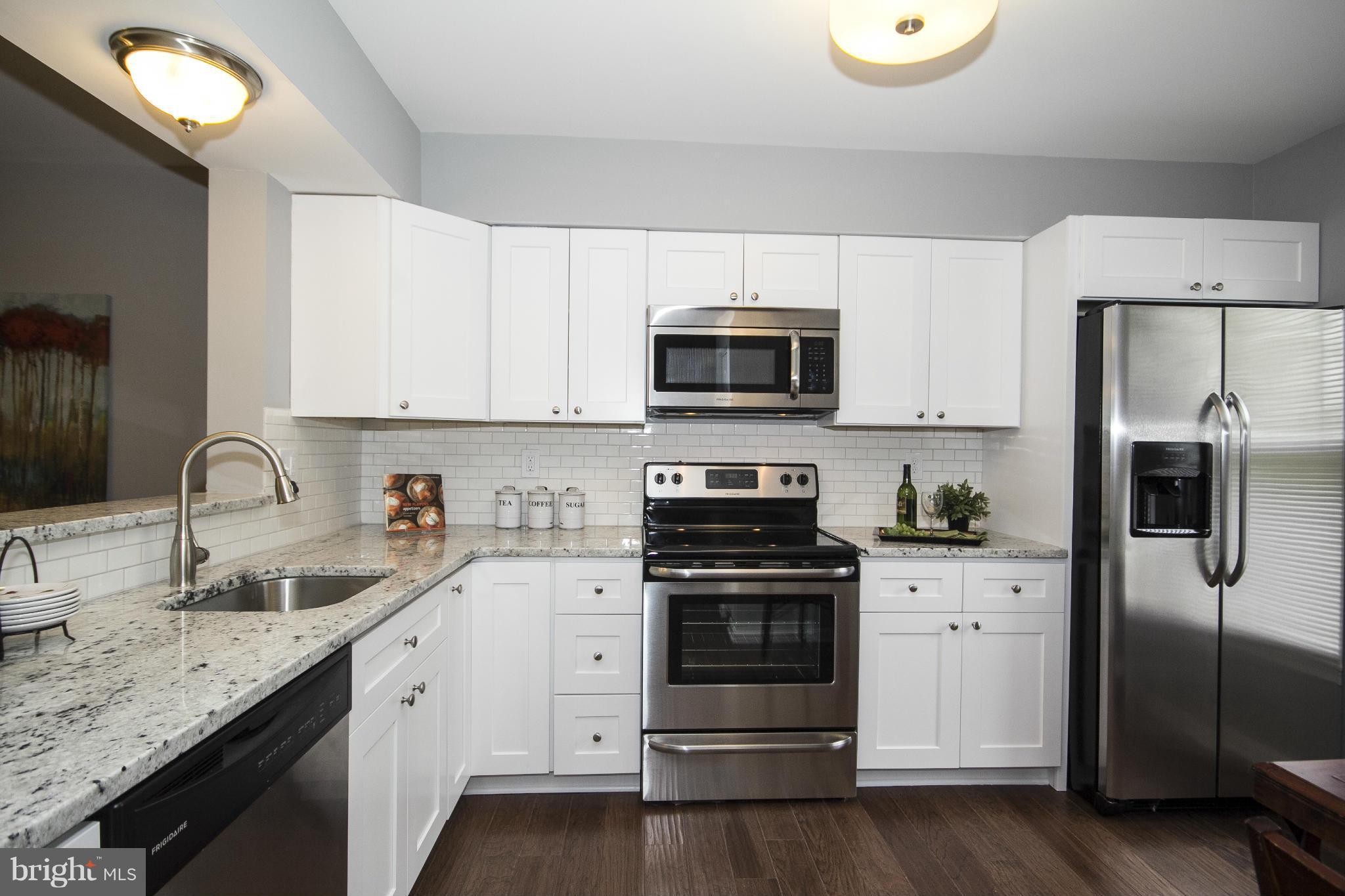 47 Robin Ridge Court Baltimore, MD 21234 - Photo 5 of 30 a kitchen with a sink appliances and cabinets