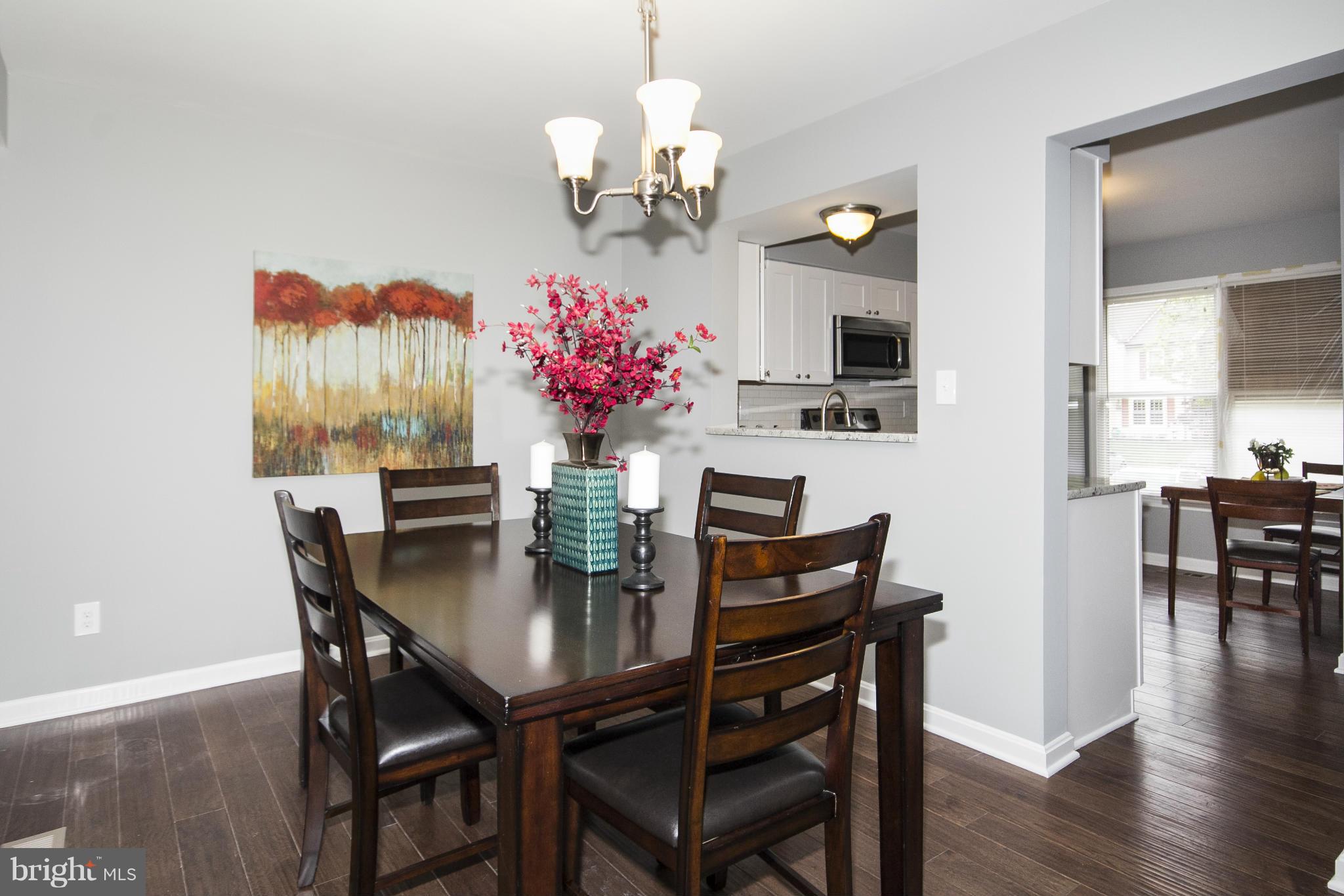 47 Robin Ridge Court Baltimore, MD 21234 - Photo 9 of 30 a view of a dining room with furniture and wooden floor