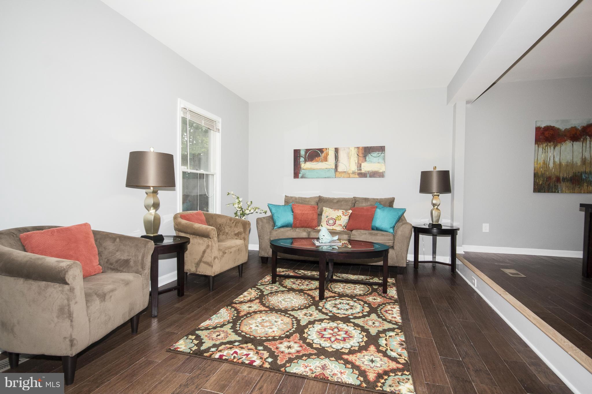 47 Robin Ridge Court Baltimore, MD 21234 - Photo 10 of 30 a living room with furniture and a flat screen tv