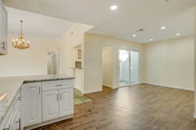 a view of a kitchen cabinets and wooden floor