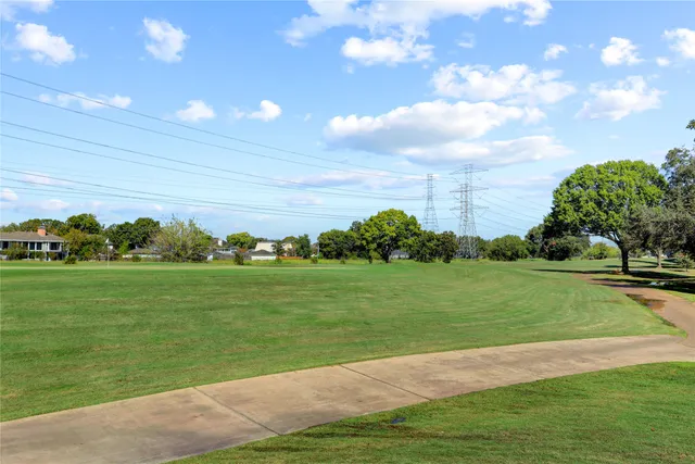 a view of a golf course with a garden
