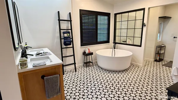 a bathroom with a sink and a shower