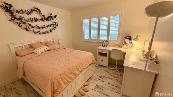 a bathroom with a sink a toilet and a shower curtain