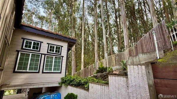 a kitchen with stainless steel appliances a refrigerator and a stove top oven
