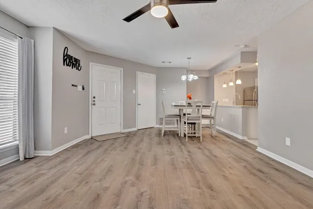 a view of a livingroom with furniture and a window