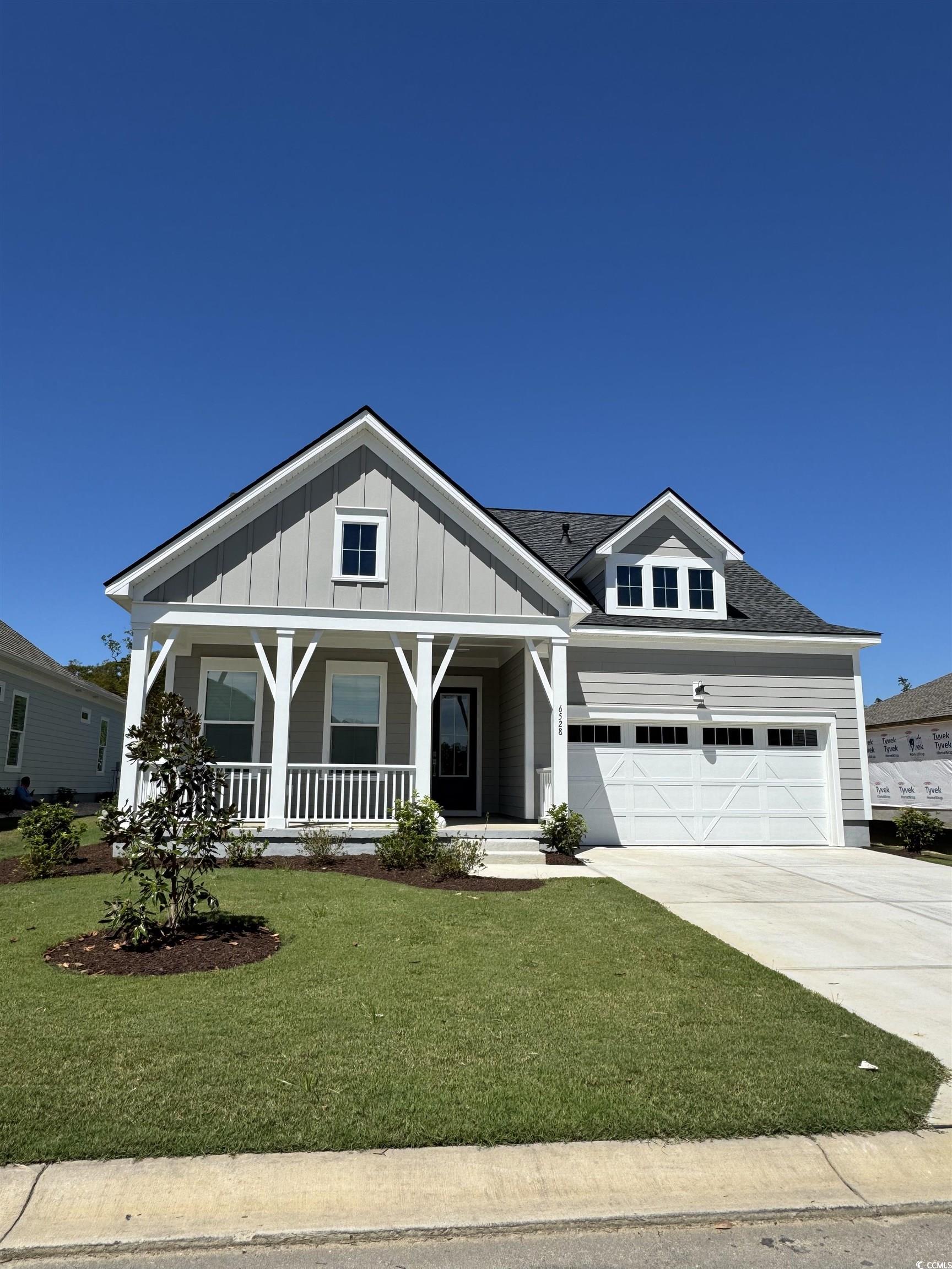 6528 Berg Street Murrells Inlet, SC 29576 - Photo 1 of 1 Craftsman-style home featuring board and batten si