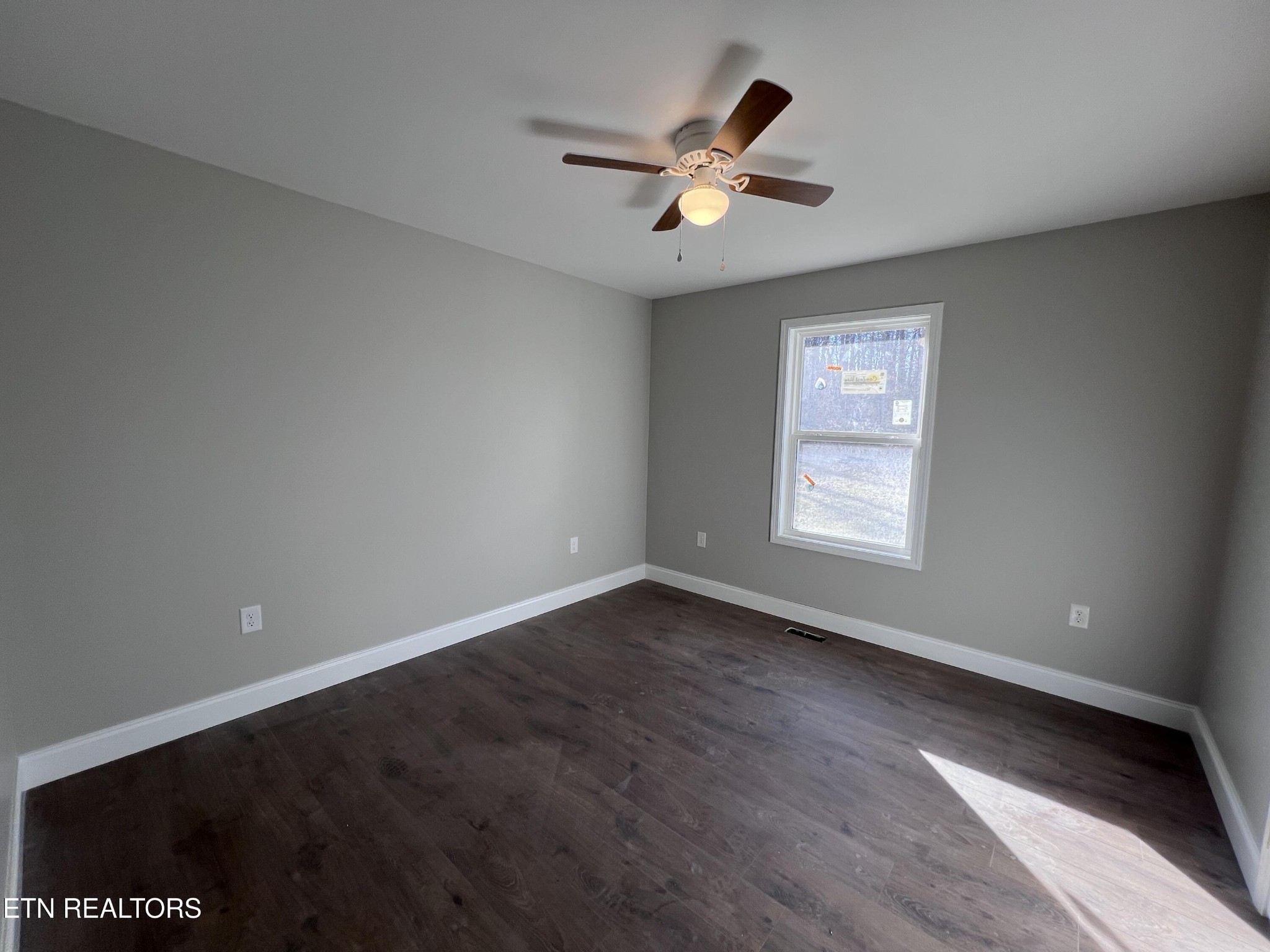 133 Jay Loop Jamestown, TN 38556 - Photo 14 of 33 a view of an empty room with wooden floor and a window