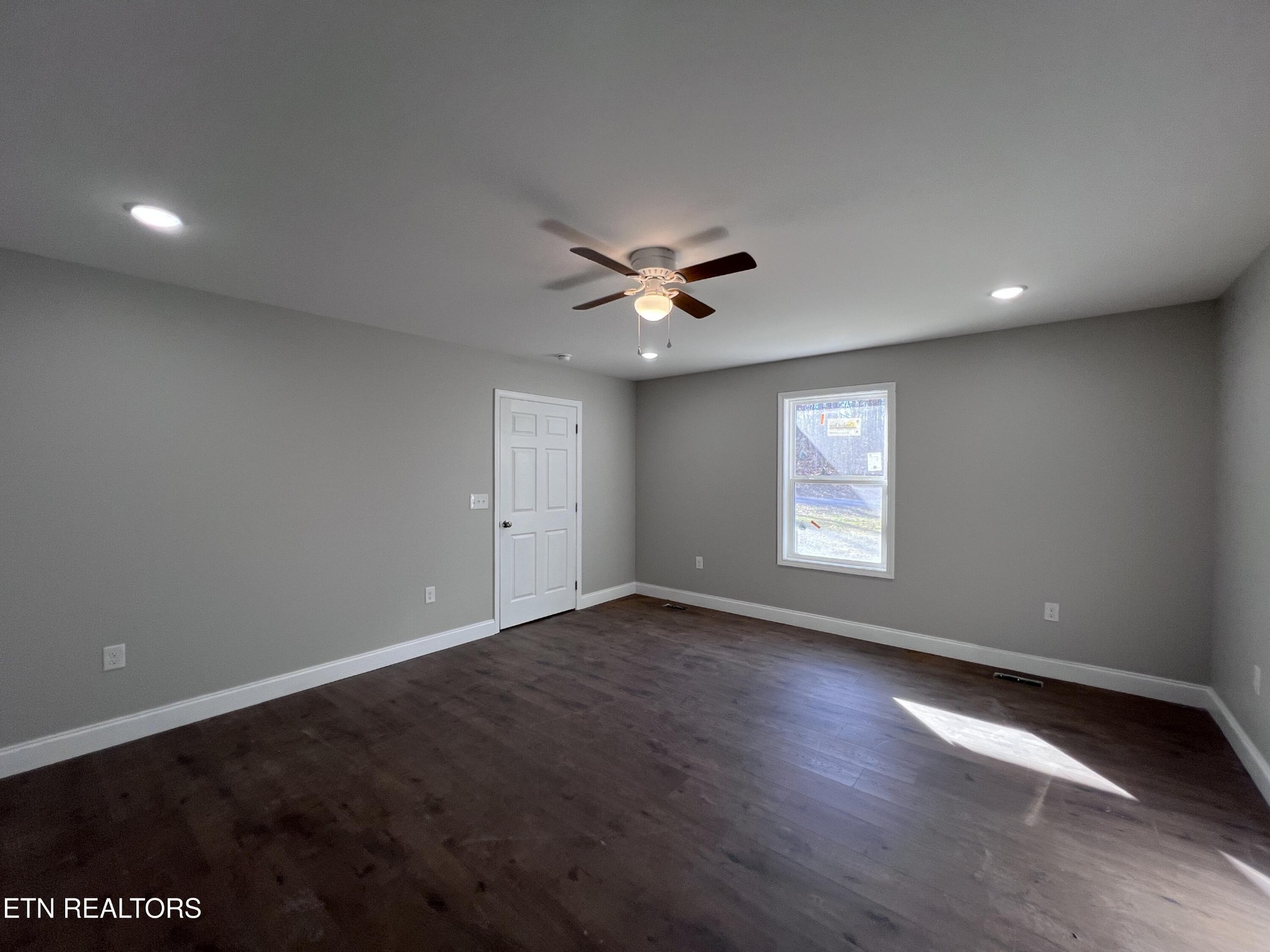 133 Jay Loop Jamestown, TN 38556 - Photo 16 of 33 an empty room with a ceiling fan and window