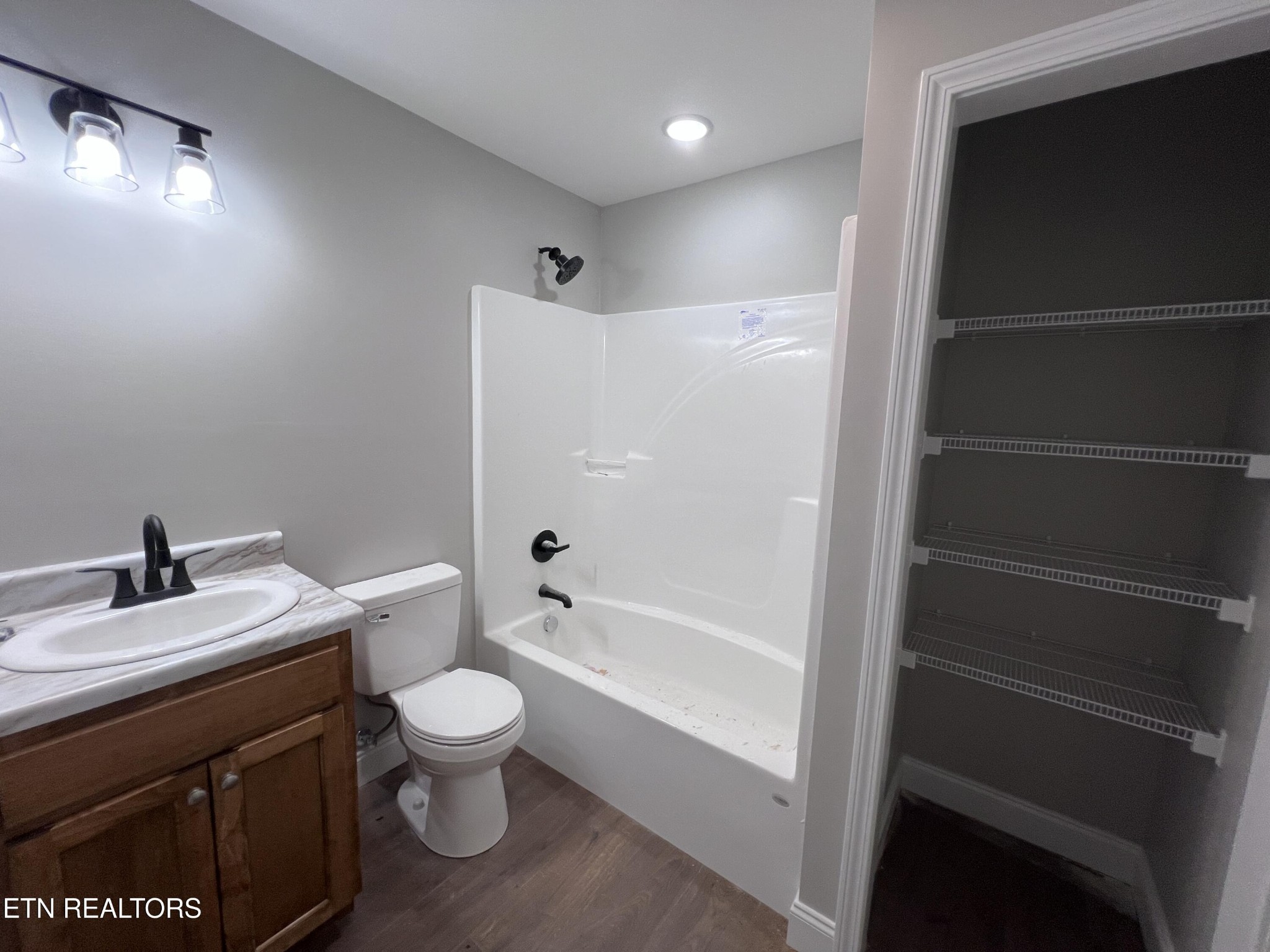 133 Jay Loop Jamestown, TN 38556 - Photo 21 of 33 a bathroom with a sink a toilet a mirror and shower