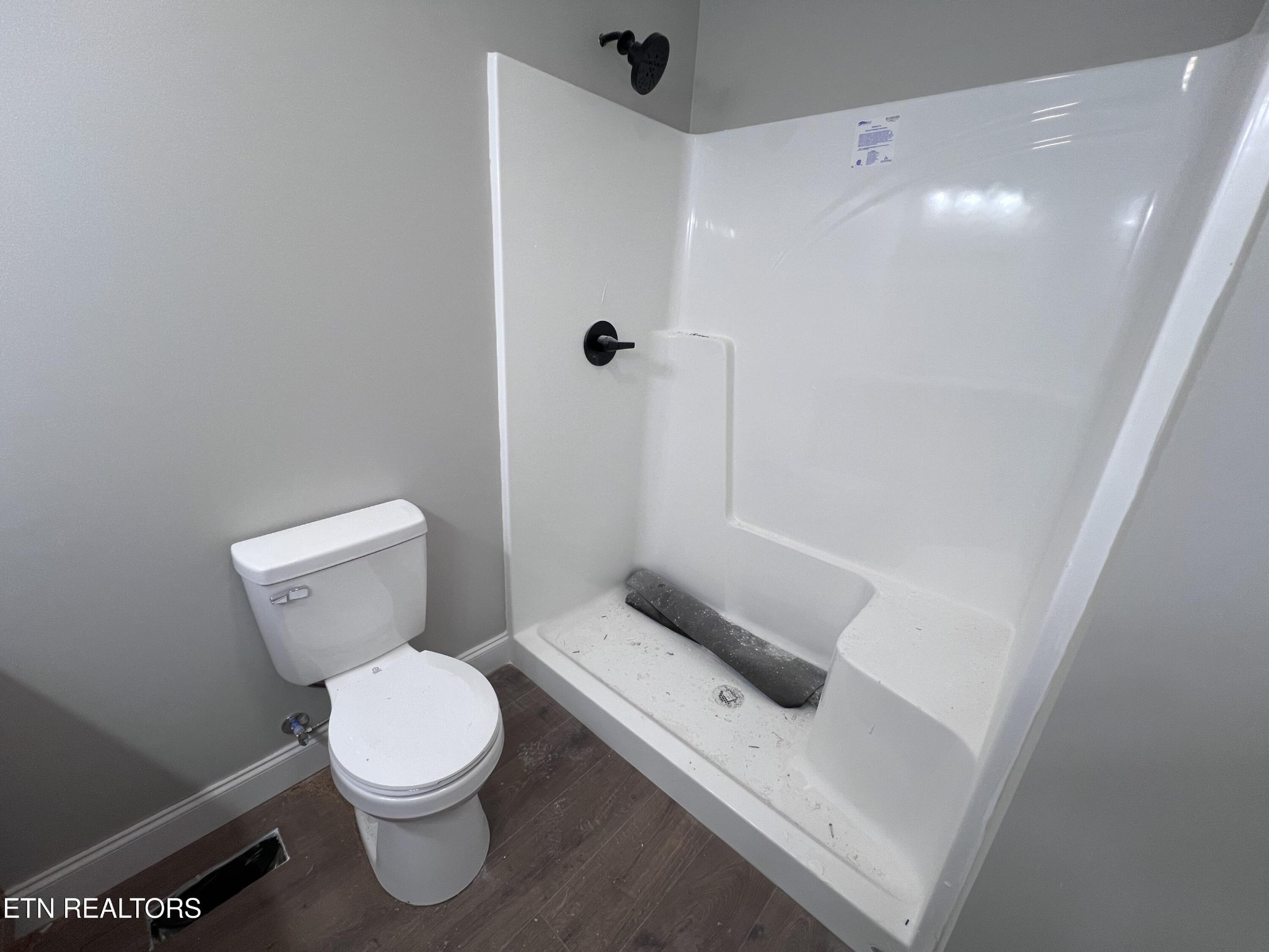 133 Jay Loop Jamestown, TN 38556 - Photo 24 of 33 a white toilet sitting next to a shower