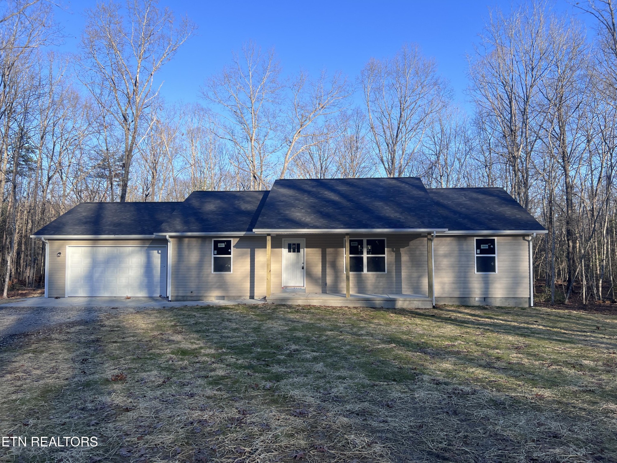 133 Jay Loop Jamestown, TN 38556 - Photo 3 of 33 a big house with large trees and a yard
