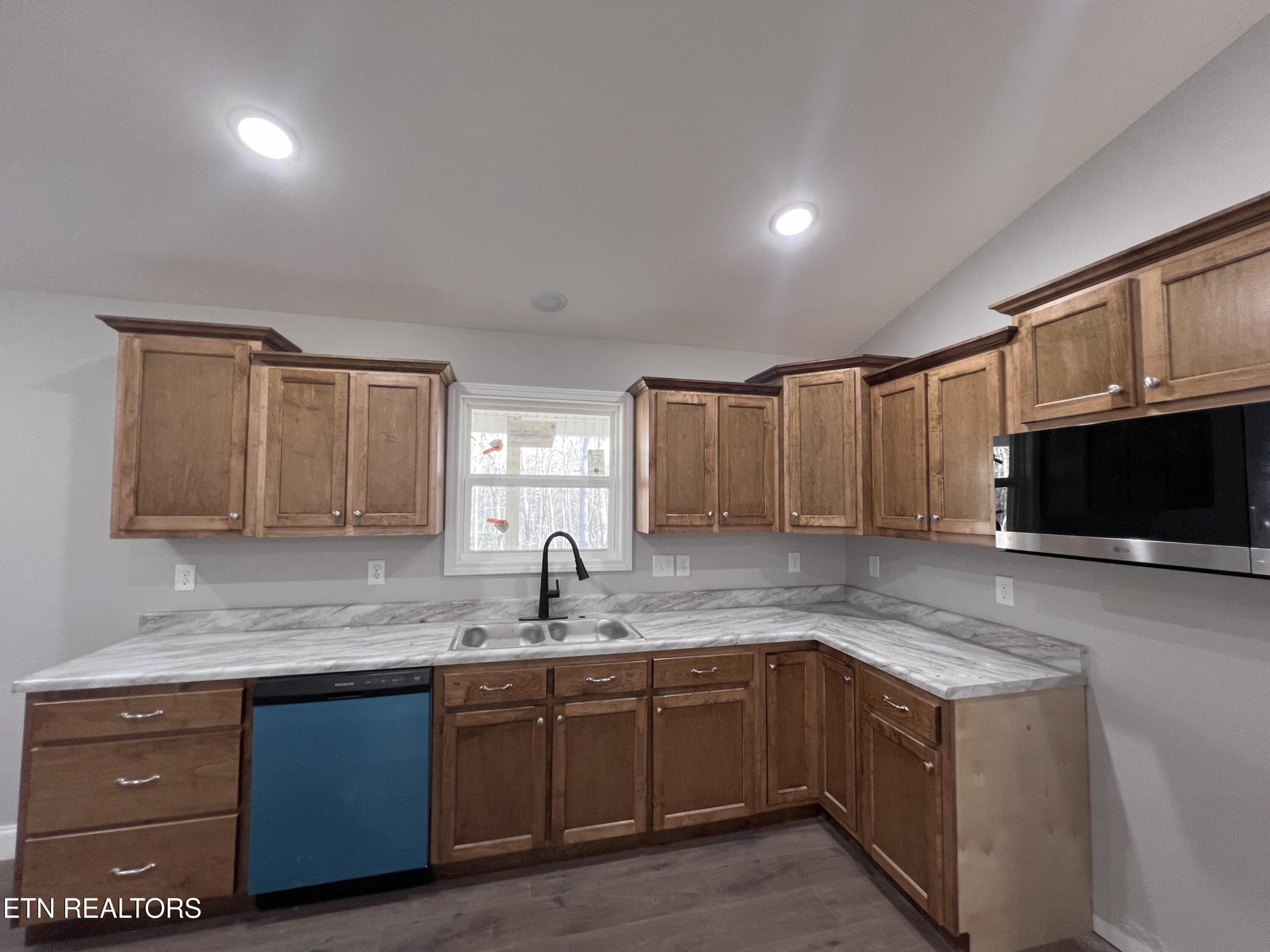 133 Jay Loop Jamestown, TN 38556 - Photo 9 of 33 a kitchen with a sink a stove and cabinets