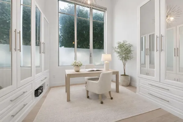 a dining room with furniture and window
