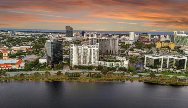 a view of a lake with tall building