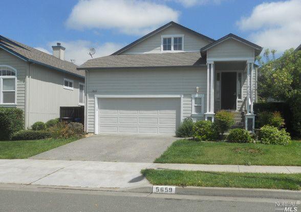 5659 Raters Drive Santa Rosa, CA 95409 - Photo 1 of 1 a front view of a house with a yard and garage