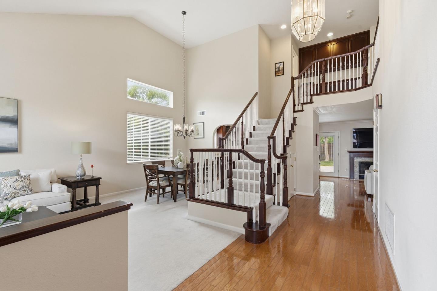 35 Sierra Ridge Court Danville, CA 94506 - Photo 3 of 37 a view of a livingroom with furniture stairs windows wooden floor and a chandelier