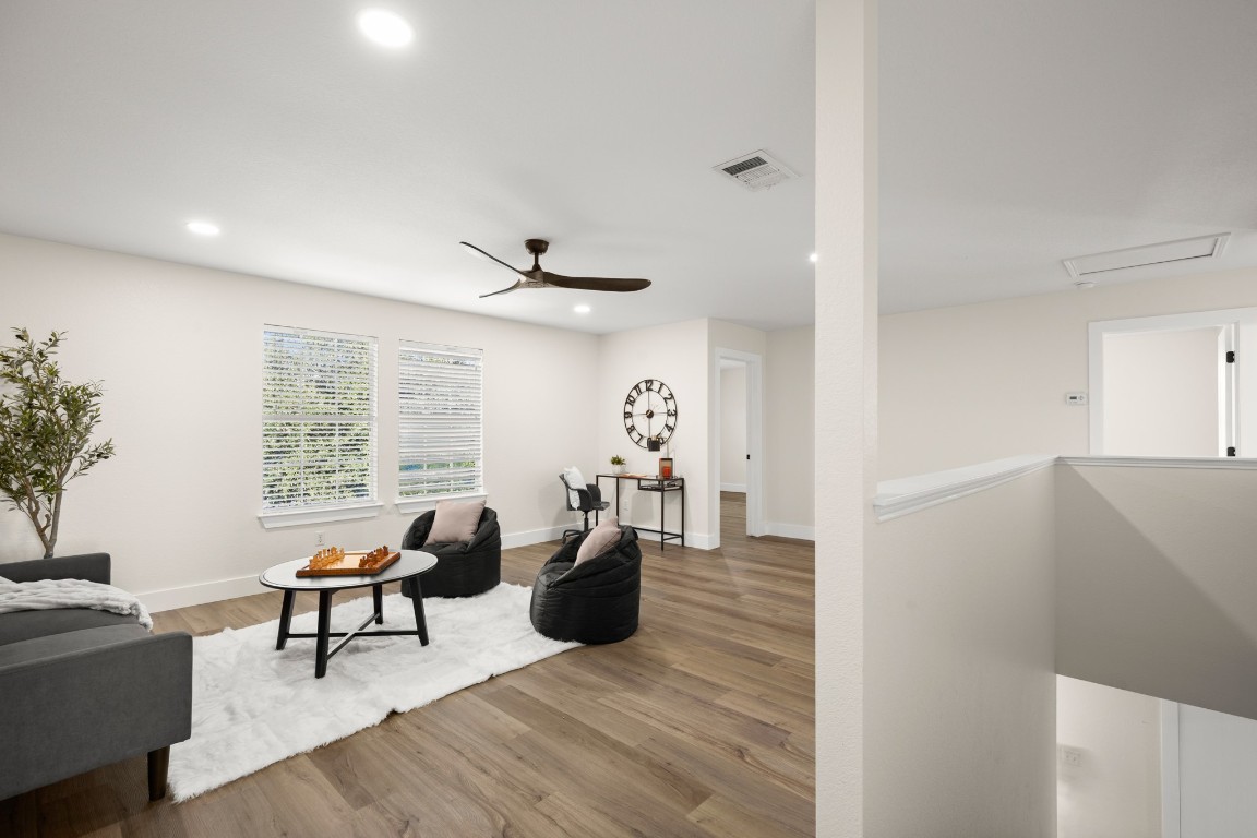 13625 Coomer Path Pflugerville, TX 78660 - Photo 13 of 22 a living room with furniture and a large window