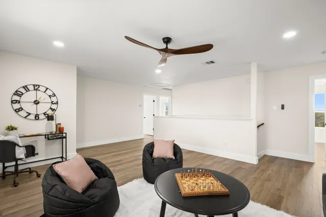 a living room with furniture and a table