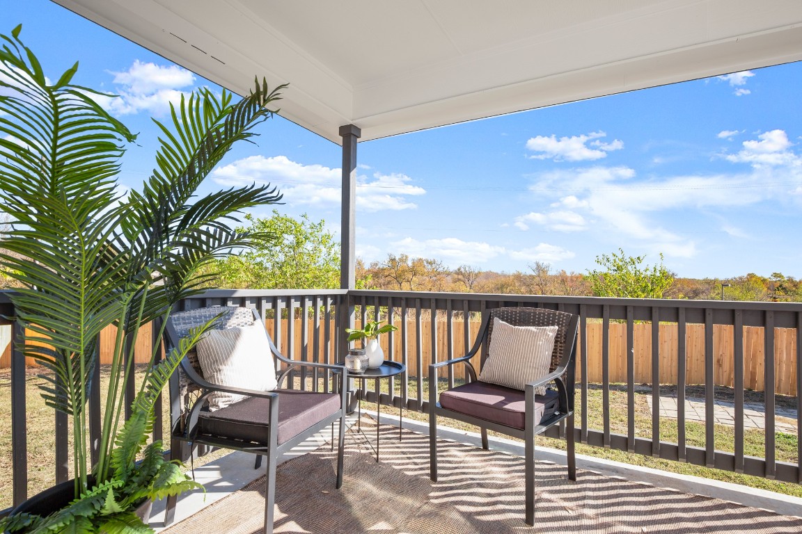 13625 Coomer Path Pflugerville, TX 78660 - Photo 20 of 22 a balcony with wooden floor outdoor seating and city view