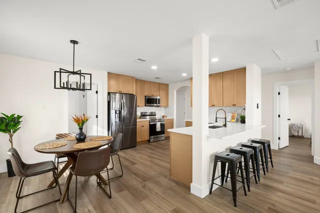 a view of a dining room with furniture window and wooden floor