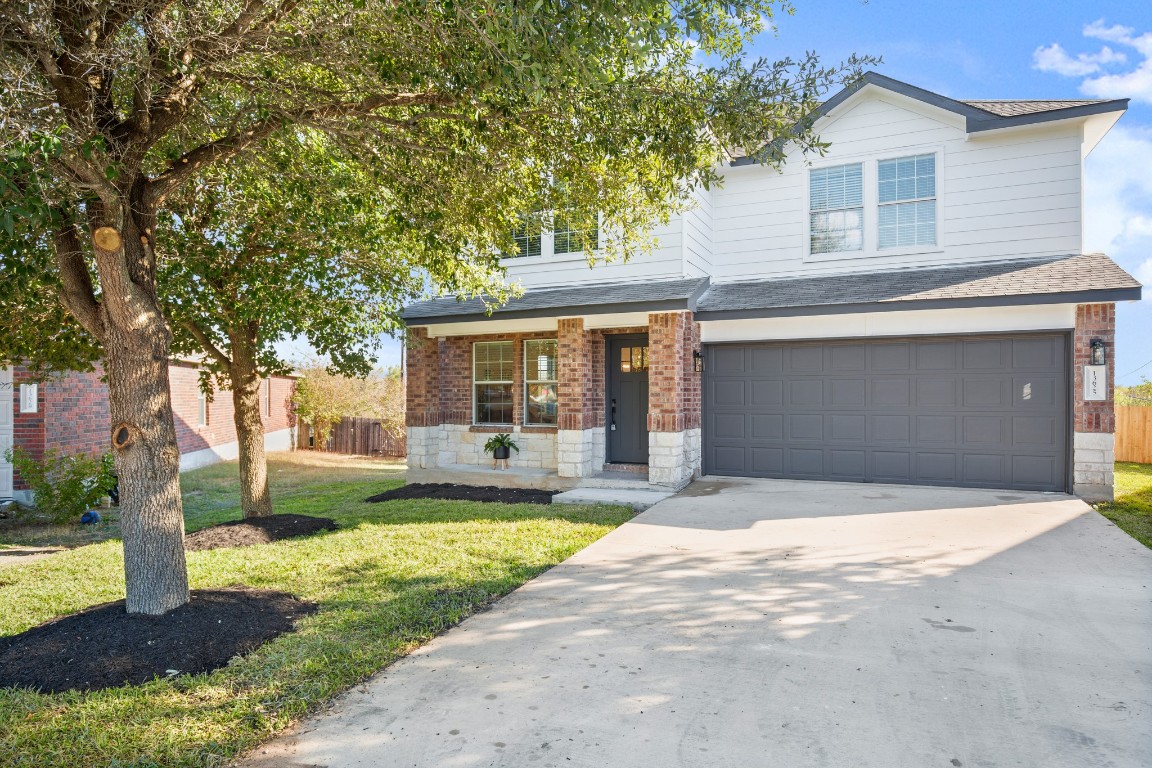 13625 Coomer Path Pflugerville, TX 78660 - Photo 22 of 22 a front view of a house with yard and green space