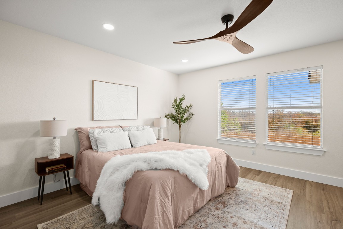 13625 Coomer Path Pflugerville, TX 78660 - Photo 10 of 22 a bedroom with a large bed and a window