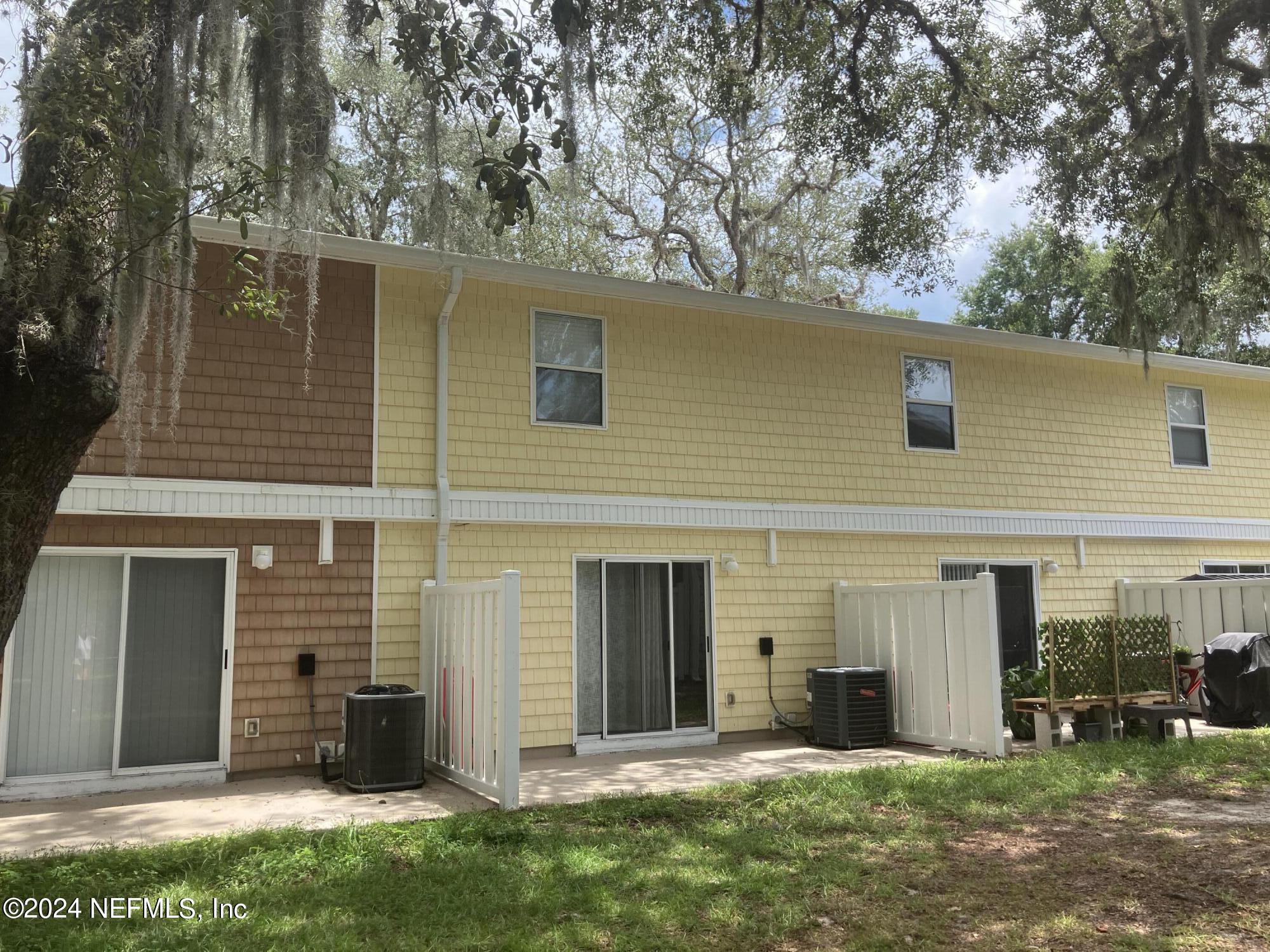 4420 Carter Road, Unit 52 St. Augustine, FL 32086 - Photo 18 of 34 front view of a house with a yard