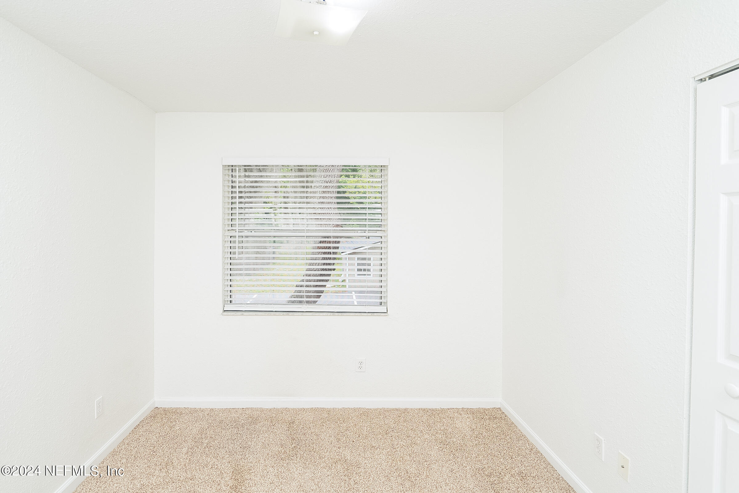 4420 Carter Road, Unit 52 St. Augustine, FL 32086 - Photo 26 of 34 a view of an empty room with a window