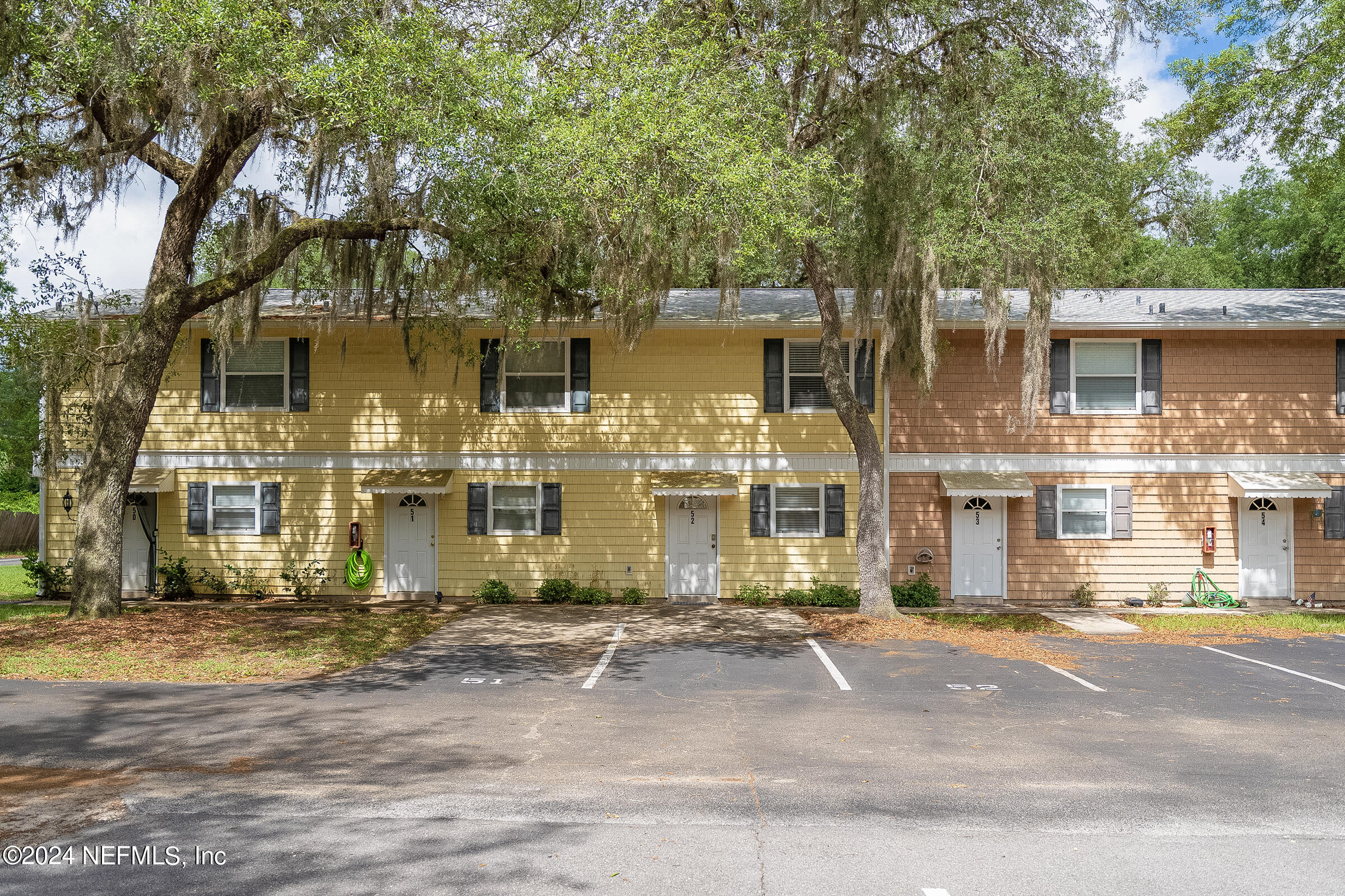 4420 Carter Road, Unit 52 St. Augustine, FL 32086 - Photo 3 of 34 front view of a house with a street