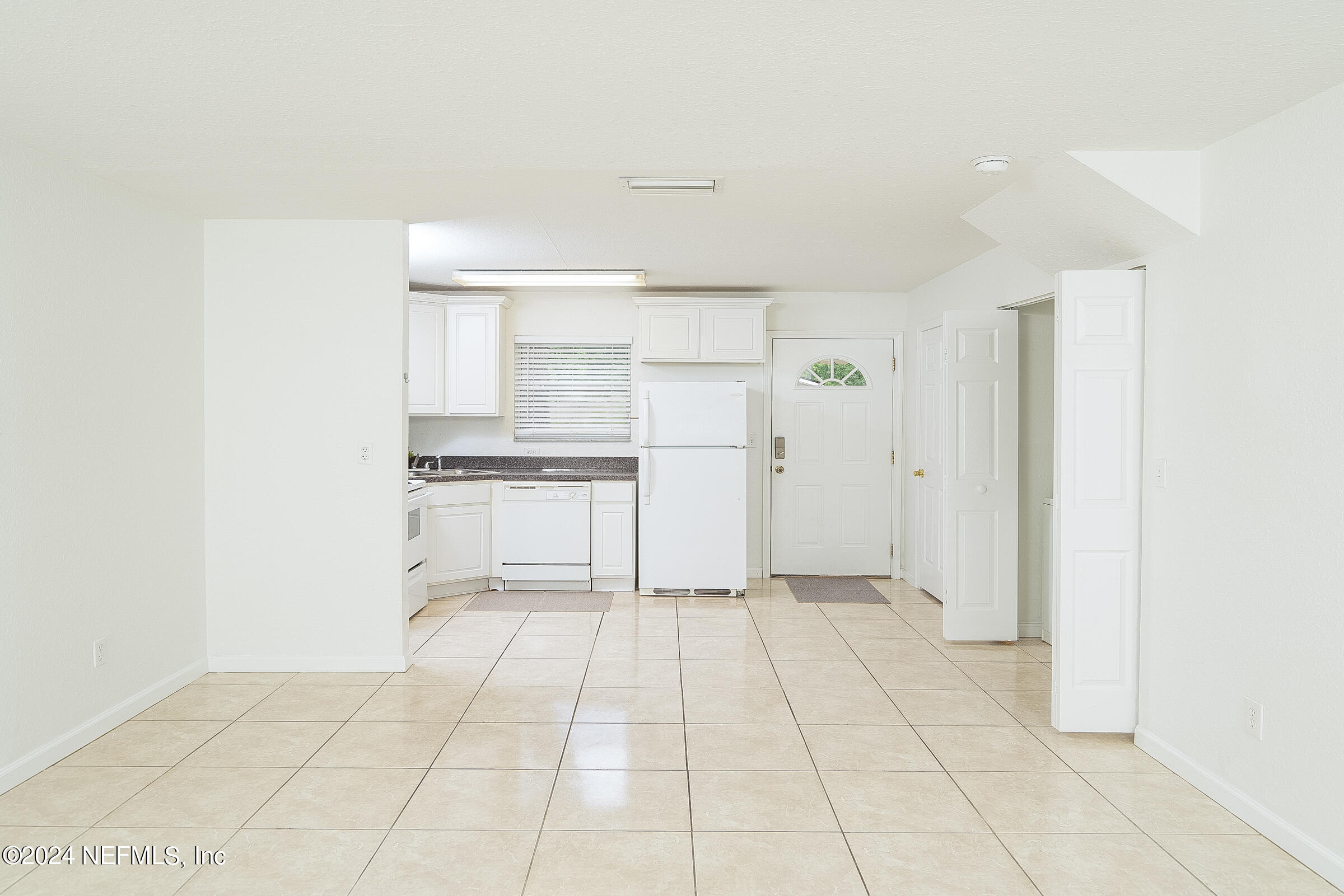 4420 Carter Road, Unit 52 St. Augustine, FL 32086 - Photo 8 of 34 a view of a kitchen with a sink and a refrigerator