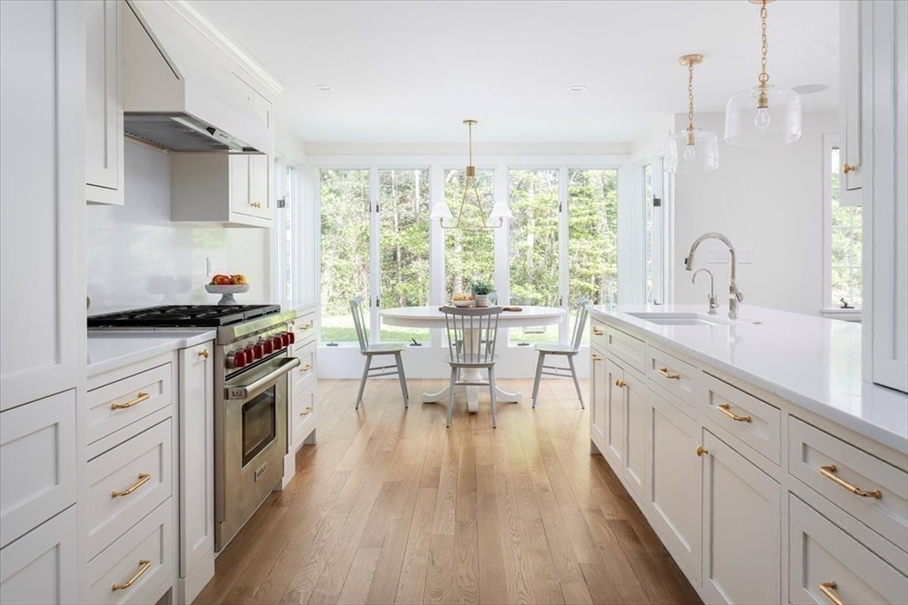 12 Meadowbrook Road Weston, MA 02493 - Photo 12 of 28 a kitchen with stainless steel appliances a lot of counter space and a wooden floors