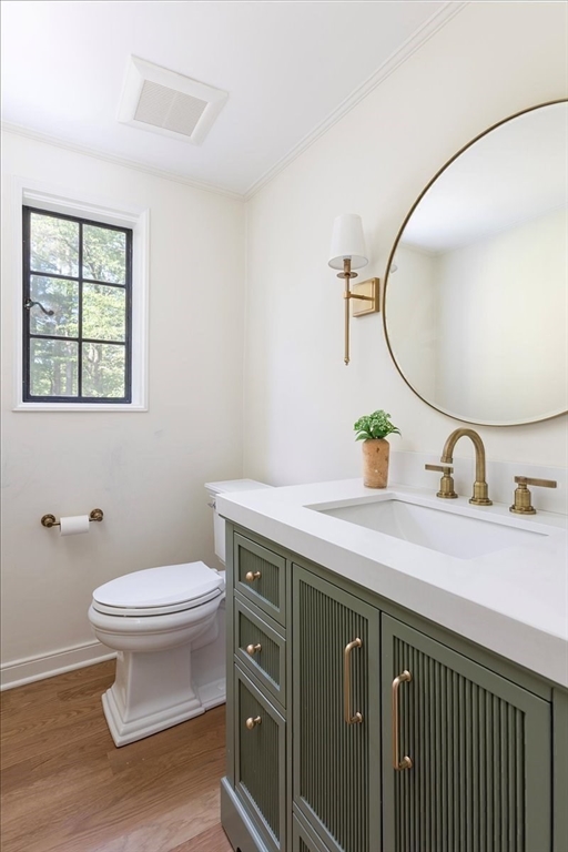 12 Meadowbrook Road Weston, MA 02493 - Photo 15 of 28 a bathroom with a toilet a sink and mirror