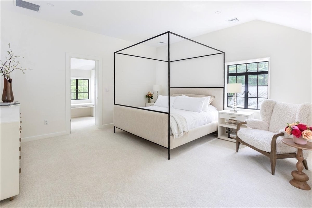 12 Meadowbrook Road Weston, MA 02493 - Photo 16 of 28 a spacious bedroom with a bed and a window