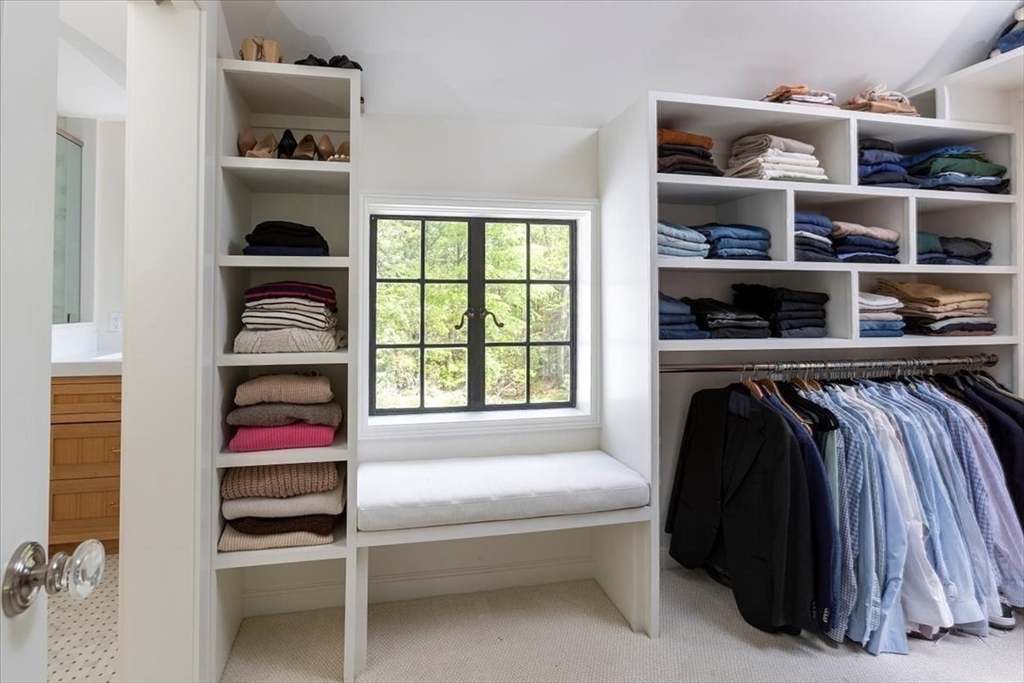 12 Meadowbrook Road Weston, MA 02493 - Photo 17 of 28 a view of walk in closet with clothes and shoes