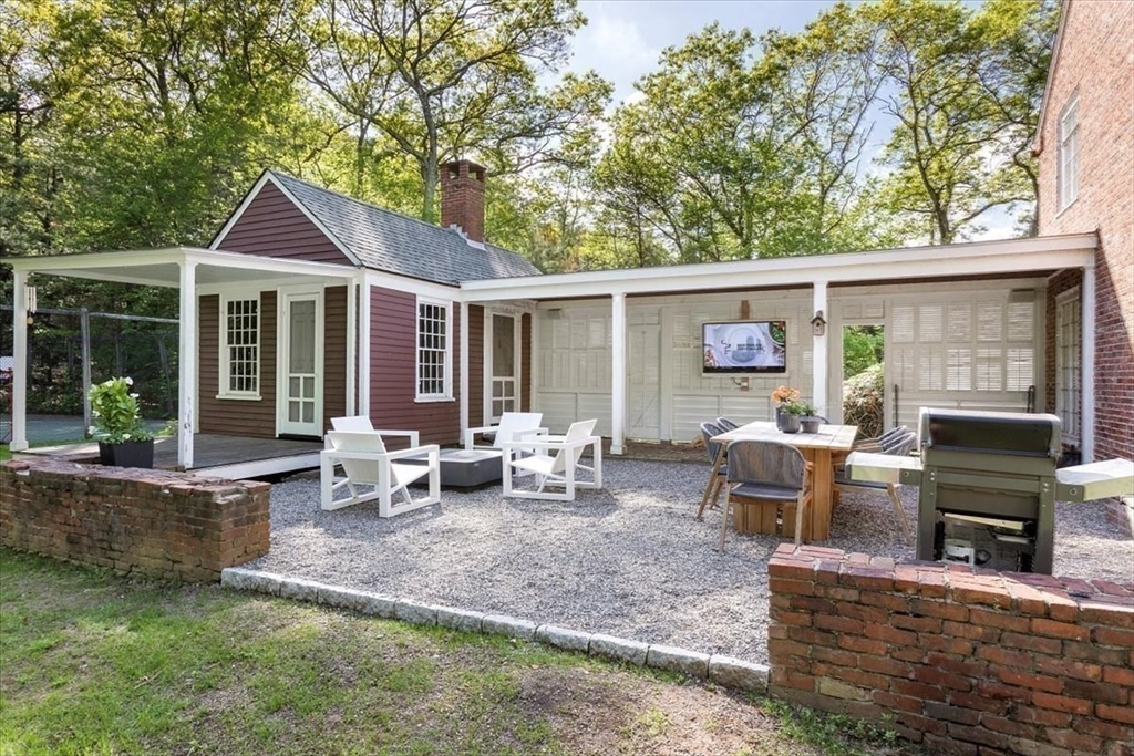 12 Meadowbrook Road Weston, MA 02493 - Photo 25 of 28 a view of a house with backyard and sitting area