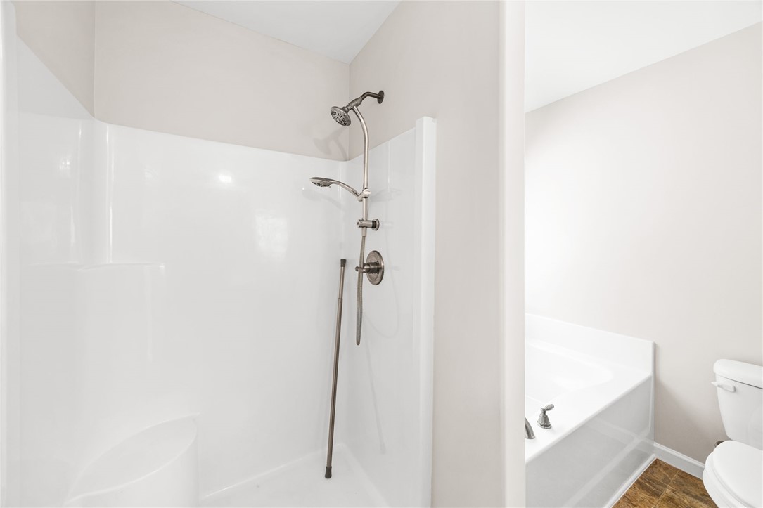 113 Crofton Court Easley, SC 29642 - Photo 27 of 33 Bright and clean bathroom featuring a functional shower and a bathtub, offering a refreshing retreat.
