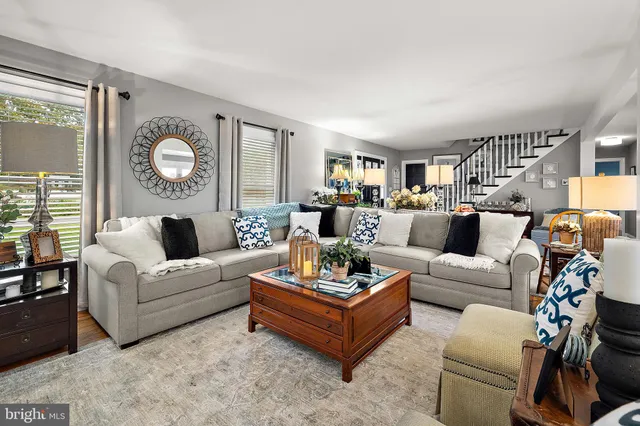 a dining room filled with furniture and a chandelier