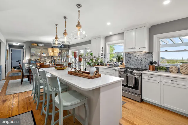 a bedroom with a bed couch and a dresser