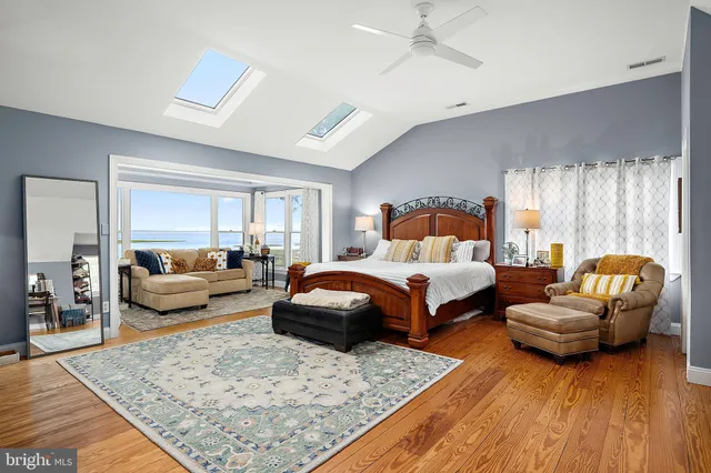 a living room with pool table and a flat screen tv