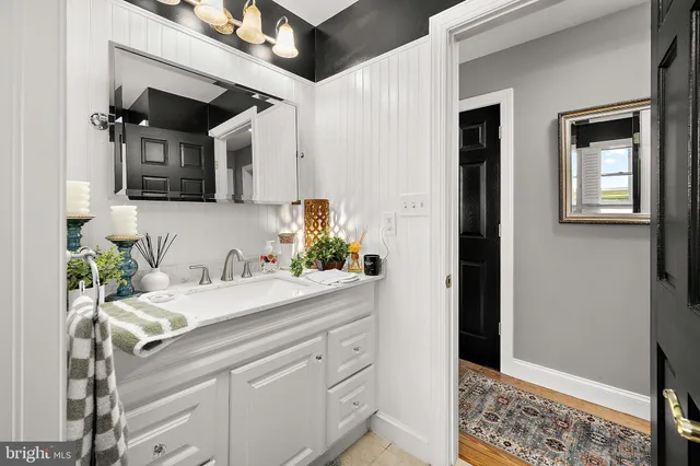 a aerial view of a house with a big yard plants and large trees