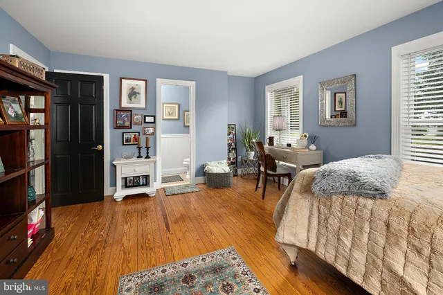 an aerial view of residential houses with outdoor space and river